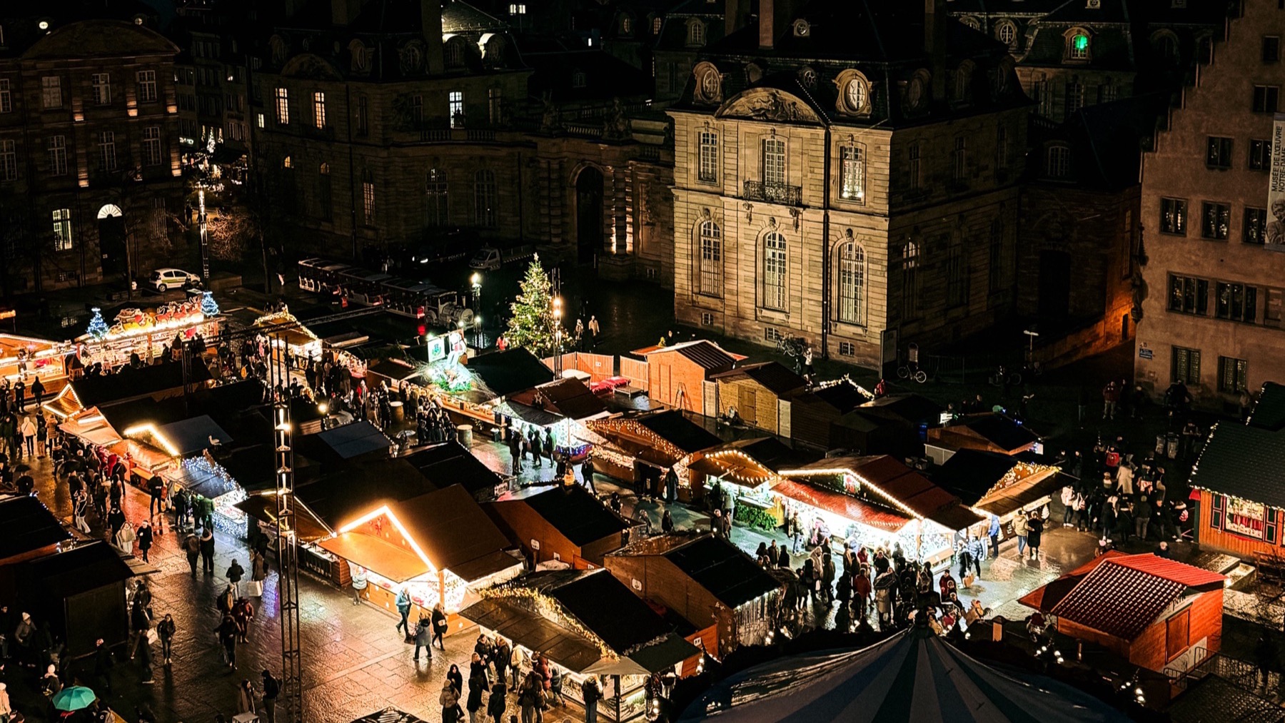 Festive European Christmas market illuminated at night